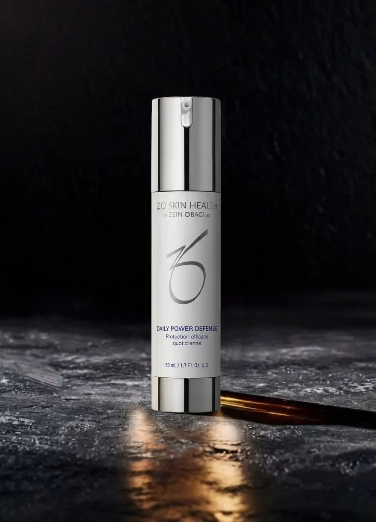 Skincare serum bottle on dark stone